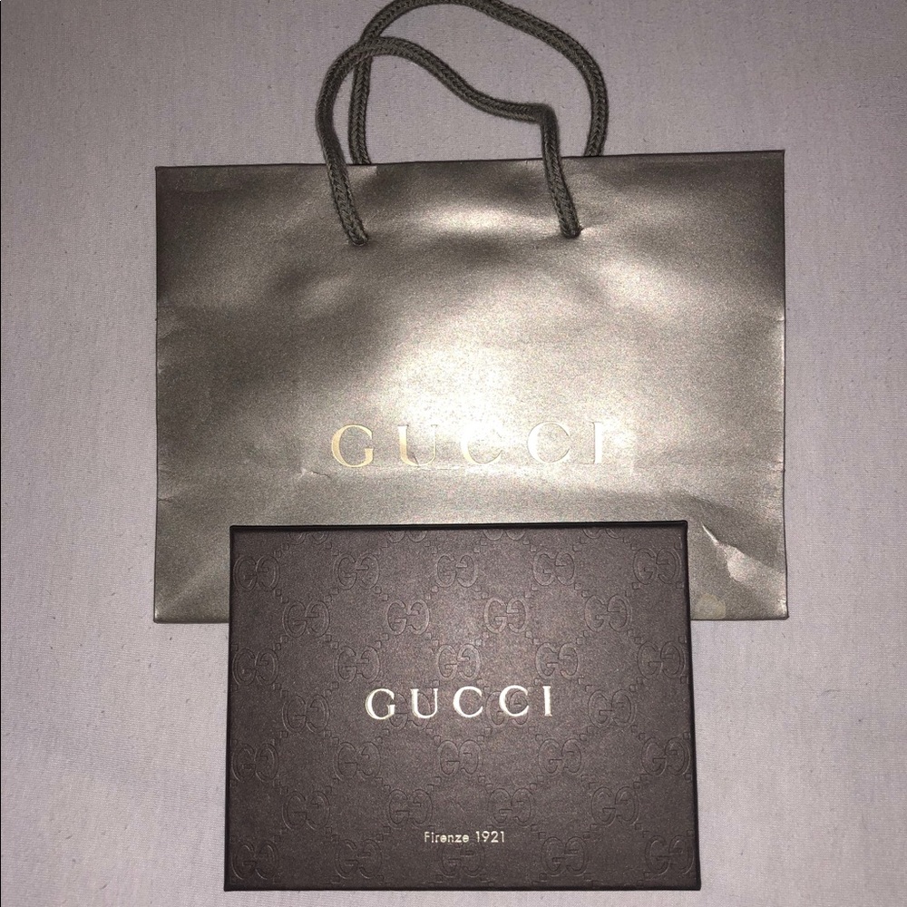 Gucci accessory box and small shopping bag